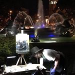 Painter painting infront of fountains at the Annual Brush Creek Art Walk